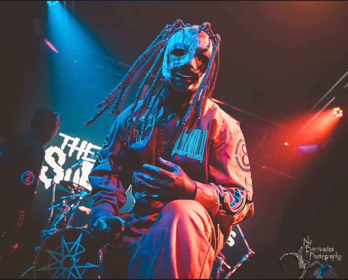 Corey Taylor wearing an Iowa-era mask onstage